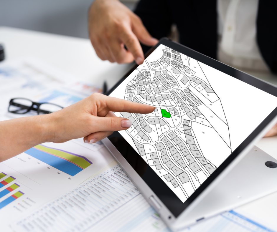 An image depicting someone looking at a planning survey map. 